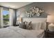 Inviting main bedroom with statement wall decor and large windows at 152 Kobus Ct, Garner, NC 27529