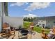 Cozy outdoor patio with adirondack seating arranged around a modern fire pit feature at 152 Kobus Ct, Garner, NC 27529