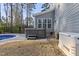 Backyard with a hot tub, generator and view of the swimming pool surrounded by a wrought iron fence at 198 Gentry Dr, Pittsboro, NC 27312