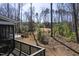 Expansive backyard with a deck overlooking the pool and lush landscaping, perfect for outdoor entertaining at 198 Gentry Dr, Pittsboro, NC 27312