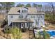 Lush backyard showcasing a swimming pool, hot tub, and manicured landscaping at 198 Gentry Dr, Pittsboro, NC 27312