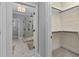 Bathroom with glass shower enclosure visible from walk-in closet at 198 Gentry Dr, Pittsboro, NC 27312