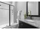 Modern bathroom with a glass-enclosed shower and granite vanity, providing a spa-like experience at 198 Gentry Dr, Pittsboro, NC 27312