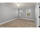 Well-lit bedroom with neutral walls, perfect for relaxation and personalization at 198 Gentry Dr, Pittsboro, NC 27312