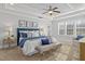 Bright bedroom boasts a tray ceiling, natural light, and a comfortable sitting area at 198 Gentry Dr, Pittsboro, NC 27312