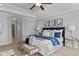 Comfortable bedroom boasts natural light, a seating area, and an ensuite bathroom at 198 Gentry Dr, Pittsboro, NC 27312