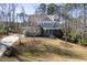 Charming two-story home with manicured lawn, mature trees, and inviting curb appeal at 198 Gentry Dr, Pittsboro, NC 27312
