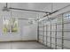Spacious garage with a white door and concrete floor, offering ample parking and storage space at 198 Gentry Dr, Pittsboro, NC 27312