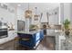Spacious eat-in kitchen featuring a blue island, granite countertops, and modern stainless steel appliances at 198 Gentry Dr, Pittsboro, NC 27312