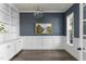 A stylish living room featuring built-in shelves and cabinets and a painting that enhances the room's aesthetic at 198 Gentry Dr, Pittsboro, NC 27312