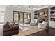 Spacious living room with fireplace, sliding glass doors to porch and comfortable seating at 198 Gentry Dr, Pittsboro, NC 27312