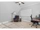 Office space with a whiteboard, office chair, desk, and leather recliner with reading lamp at 198 Gentry Dr, Pittsboro, NC 27312