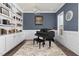 Home office features built in shelves, a piano and natural lighting at 198 Gentry Dr, Pittsboro, NC 27312