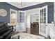 Home office with piano, interior French doors, and views to the formal dining room at 198 Gentry Dr, Pittsboro, NC 27312