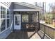 Relaxing screened-in porch with wooden floors and comfortable seating, perfect for enjoying the outdoors at 198 Gentry Dr, Pittsboro, NC 27312