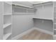 Spacious walk-in closet with built-in shelving and hanging rods, offering ample storage space at 198 Gentry Dr, Pittsboro, NC 27312