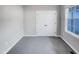 This bedroom has neutral walls, carpet, a window, and closet at 201 Silver Creek Dr, Clayton, NC 27520