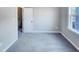 This bedroom features neutral walls, carpet, and a window at 201 Silver Creek Dr, Clayton, NC 27520