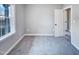 This bedroom has carpet, neutral walls, and a window at 201 Silver Creek Dr, Clayton, NC 27520