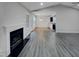 An open-concept living room with fireplace, high ceilings, neutral walls, and lots of light at 201 Silver Creek Dr, Clayton, NC 27520