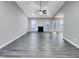Bright living room featuring a vaulted ceiling, recessed lighting, fireplace, ceiling fan, and hardwood flooring at 201 Silver Creek Dr, Clayton, NC 27520