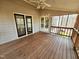 Spacious back porch featuring wood flooring, ceiling fan, and views of the backyard at 2024 Fox Den, Clayton, NC 27527