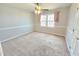 Neutral bedroom features plush carpet, a ceiling fan, and soft natural light at 2024 Fox Den, Clayton, NC 27527