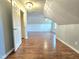 Spacious bonus room featuring hardwood floors, neutral paint, and an open layout at 2024 Fox Den, Clayton, NC 27527