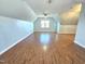 Bright bonus room with hardwood floors, neutral paint, and a window at 2024 Fox Den, Clayton, NC 27527