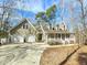 Well-maintained home featuring a covered porch and two-car garage at 2024 Fox Den, Clayton, NC 27527
