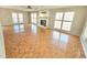 Open living room with parquet floors, fireplace and bright windows at 2024 Fox Den, Clayton, NC 27527