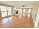 Bright living room featuring a fireplace, large windows, and beautiful parquet floors at 2024 Fox Den, Clayton, NC 27527
