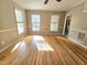 Bright living room boasting hardwood floors, and lots of windows flooding the space with natural light at 2024 Fox Den, Clayton, NC 27527