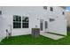 Newly installed air conditioner in the backyard of a townhome at 208 Starlight St, Sanford, NC 27330