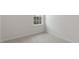 Carpeted bedroom featuring a large window at 208 Starlight St, Sanford, NC 27330