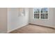 Bright dining room with wood-look floors, and a large window at 208 Starlight St, Sanford, NC 27330