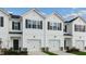 Inviting townhome exteriors with well-manicured lawns and single car garages at 208 Starlight St, Sanford, NC 27330