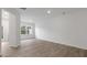 Bright living room featuring an open floor plan and wood-look floors at 208 Starlight St, Sanford, NC 27330