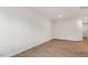 Spacious living room with neutral walls and wood-look floors at 208 Starlight St, Sanford, NC 27330