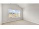 Neutral bedroom with natural light from the window at 216 Starlight St, Sanford, NC 27330