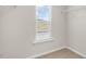 Well-lit walk-in closet featuring a window and shelving at 216 Starlight St, Sanford, NC 27330