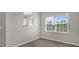 Cozy dining area with wood-look floors, a window, and open access to the kitchen at 216 Starlight St, Sanford, NC 27330