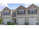 Attractive townhomes with individual single-car garages and pleasant landscaping at 216 Starlight St, Sanford, NC 27330