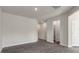 Open-concept living space with wood-look floors and easy access to other rooms at 216 Starlight St, Sanford, NC 27330