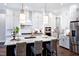 Gourmet kitchen boasting an island, stainless steel appliances, and designer light fixtures at 223 Harvester Rd, Angier, NC 27501