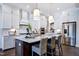 Elegant kitchen featuring marble countertops, pendant lighting, and stainless steel appliances at 223 Harvester Rd, Angier, NC 27501