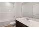 Modern bathroom with a bathtub, shower, and quartz countertop at 260 Chesapeake Commons St # 156, Garner, NC 27529