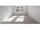 Bright bedroom featuring neutral carpet, white walls and natural light at 260 Chesapeake Commons St # 156, Garner, NC 27529
