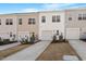 Modern townhome exterior featuring individual driveways and attached garages at 260 Chesapeake Commons St # 156, Garner, NC 27529