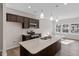Well-appointed kitchen with large island, stainless steel appliances and pendant lighting at 260 Chesapeake Commons St # 156, Garner, NC 27529